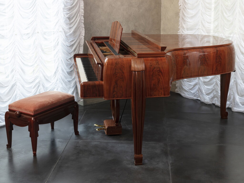 View full screen - View 1 of Lot 160. Piano and stool, circa 1921.