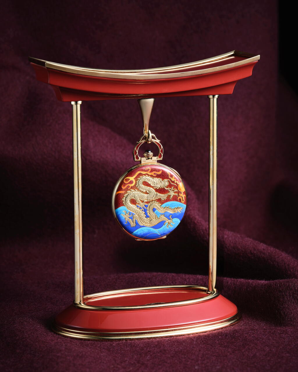 View full screen - View 1 of Lot 2267. "Fire Dragon", Reference 982/155J-001 | A possibly unique yellow gold openface keyless lever watch with power reserve indication, decorated with hand-engraved dragon on cloisonné enamel and Chinese numerals, Accompanied with presentation stand, Made for the opening of the Shanghai Patek Philippe Maison, Circa 2013.