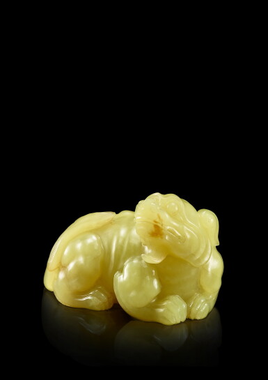 View full screen - View 1 of Lot 3670. A yellow jade figure of a mythical beast, Qing dynasty, 18th century | 清十八世紀 黃玉瑞獸.