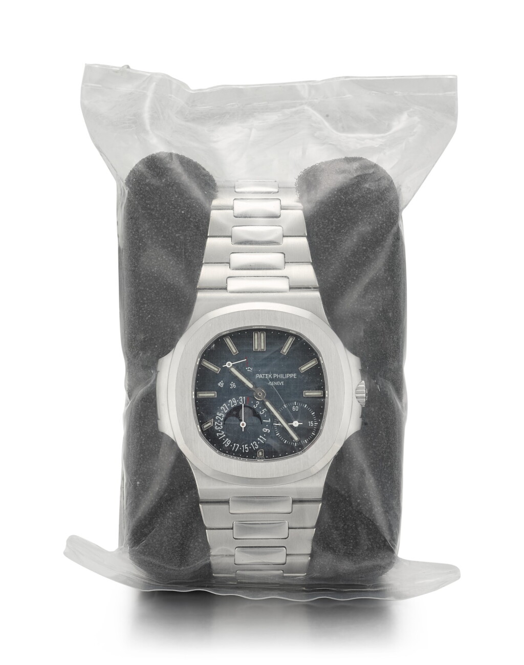 View full screen - View 1 of Lot 22. PATEK PHILIPPE | NAUTILUS, REFERENCE 5712, A BRAND NEW STAINLESS STEEL WRISTWATCH WITH DATE, MOON PHASES, POWER RESERVE INDICATION AND BRACELET, CIRCA 2007 .