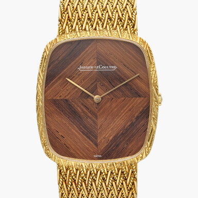 View full screen - View 1 of Lot 588. A yellow gold bracelet watch with wood dial, Circa 1970.