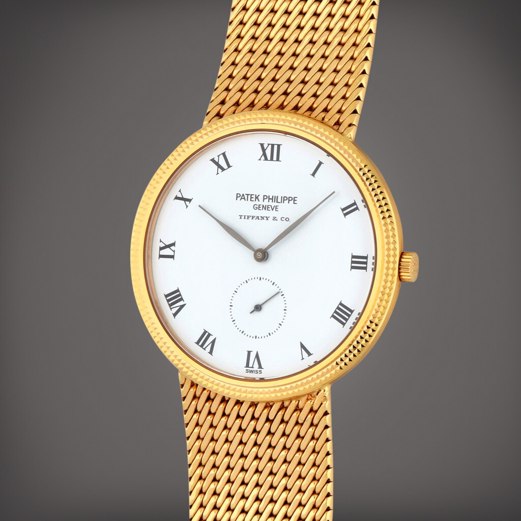 View full screen - View 1 of Lot 377. Retailed by Tiffany & Co.: Reference 3919/5J | A yellow gold bracelet watch | Circa 1996.