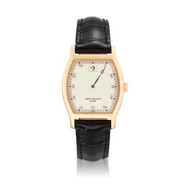 View full screen - View 1 of Lot 53. Reference 3969, A limited edition pink gold tonneau shaped jump hour wristwatch, Made to Commemorate the 150th Anniversary of Patek Philippe, Made in 1989 .