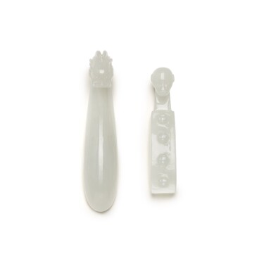 View full screen - View 1 of Lot 221. TWO PALE CELADON JADE BELT HOOKS, QING DYNASTY, 19TH CENTURY | 清十九世紀 青白玉雕螭龍紋帶鉤 及 白玉猴首帶鉤 一組兩件.