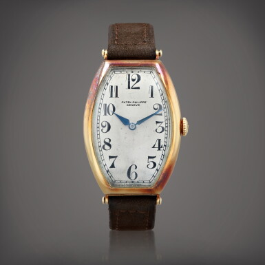 View full screen - View 1 of Lot 604. Montre bracelet tonneau en or jaune | Yellow gold tonneau-shaped wristwatch Vers 1920 | Circa 1920.