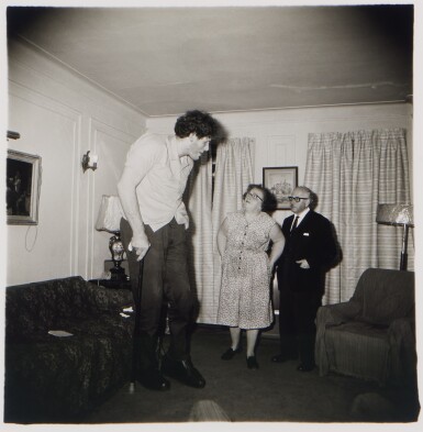 View full screen - View 1 of Lot 142. 'A Jewish giant at home with his parents in the Bronx, N. Y.'.