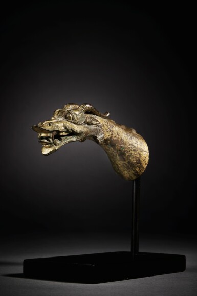 View full screen - View 1 of Lot 145. A very rare gilt-bronze 'dragon head' handle, Eastern Han Dynasty.