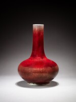 A 'sang-de-boeuf' glazed bottle vase, Qing dynasty, 18th-19th century | 清十八至十九世紀 郎窰紅釉長頸瓶