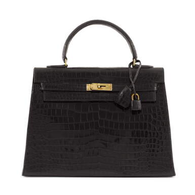 View full screen - View 1 of Lot 54. Noir Shiny Crocodile Kelly Sellier 32 Gold Hardware, 1964.