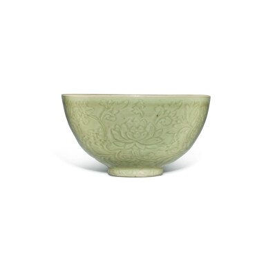 View full screen - View 1 of Lot 141. A finely carved 'Longquan' celadon-glazed 'floral' bowl, Ming dynasty, Yongle / Xuande period | 明永樂 / 宣德 龍泉窰青釉四季花卉紋盌.