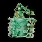 A jadeite 'bird and flower' vase and cover, Early 20th century | 二十世紀初 翠玉浮雕花鳥紋蓋瓶
