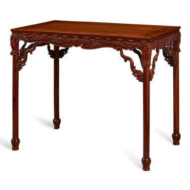 View full screen - View 1 of Lot 99. AN IMPORTANT AND VERY RARE HUANGHUALI TABLE, BANZHUO MING DYNASTY, 16TH – 17TH CENTURY | 明十六至十七世紀 黃花梨雕龍鳳花鳥紋束腰矮桌展腿式半桌.