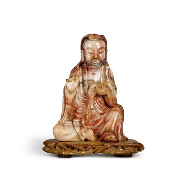 View full screen - View 1 of Lot 373. A superb parcel-gilt soapstone figure of a Luohan, Qing dynasty, 18th century | 清十八世紀 壽山石雕羅漢坐像.