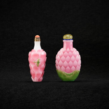 View full screen - View 1 of Lot 988. Two pink overlay white 'lotus' glass snuff bottles, Qing dynasty, 18th - 19th century | 清十八至十九世紀 白套粉紅料蓮花形鼻煙壺 兩件.