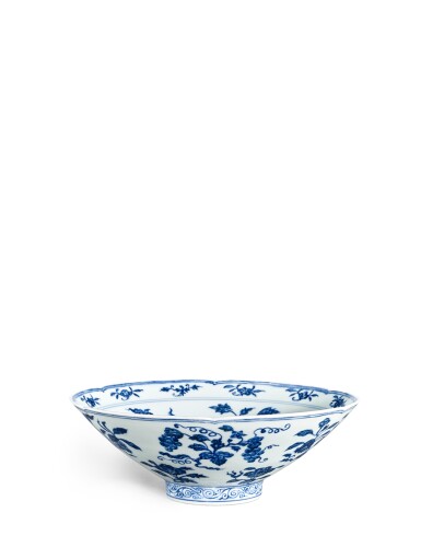View full screen - View 1 of Lot 803. A fine and very rare blue and white lobed bowl, Mark and period of Xuande | 明宣德 青花折枝花果紋葵式盌 《大明宣德年製》款.