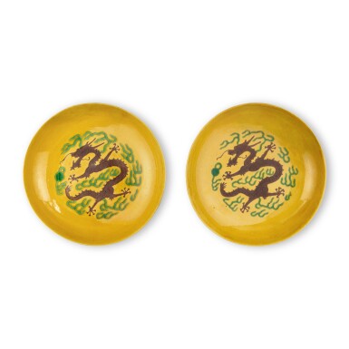 View full screen - View 1 of Lot 7. A pair of yellow-ground green and aubergine-enameled 'dragon' dishes, Marks and period of Guangxu.