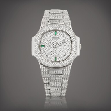 View full screen - View 1 of Lot 2142. Nautilus, Reference 3800 | A white gold, diamond and emerald-set bracelet watch with date, Made in 1993 | 百達翡麗 | NAUTILUS 型號3800 | 白金鑲鑽石及綠寶石鏈帶腕錶,備日期顯示,1993年製.