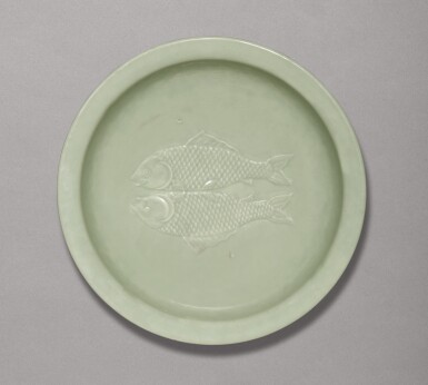 View full screen - View 1 of Lot 31. A RARE CELADON-GLAZED 'TWIN FISH' DISH, QIANLONG IMPRESSED SEAL MARK AND PERIOD | 清乾隆 粉青釉雙魚折沿盤 《大清乾隆年製》款.