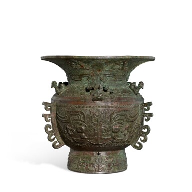 View full screen - View 1 of Lot 3590. A bronze archaistic 'mask' vessel, zun, Ming dynasty or earlier | 明或更早 青銅仿古獸面紋出戟尊.