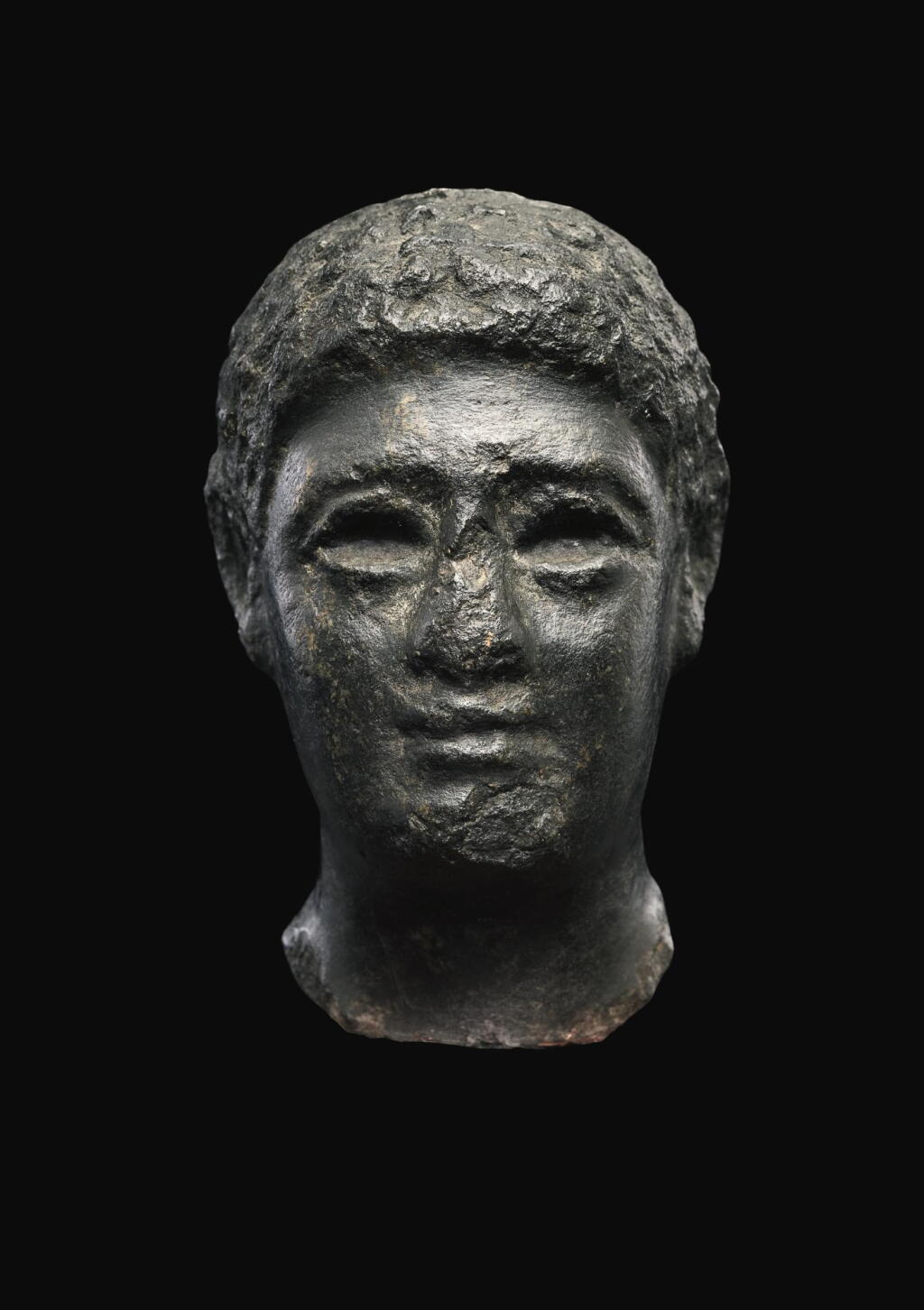 View full screen - View 1 of Lot 55. AN EGYPTIAN BASALT HEAD OF A MAN, LATE PTOLEMAIC PERIOD, CIRCA 100-30 B.C..