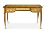 A LOUIS XVI STYLE GILT-BRONZE MOUNTED AMARANTH, SATINWOOD PARQUETRY BUREAU PLAT, AFTER A MODEL BY JEAN-HENRI RIESENER, CIRCA 1880