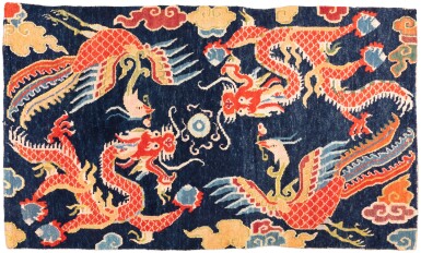 View full screen - View 1 of Lot 26. A blue-ground 'red dragon and phoenix' carpet, Tibet, 19th / 20th century | 西藏 十九 / 二十世紀 藍地龍紋地毯.
