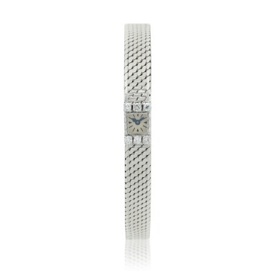 View full screen - View 1 of Lot 59. A white gold and diamond set bracelet watch, Circa 1940.