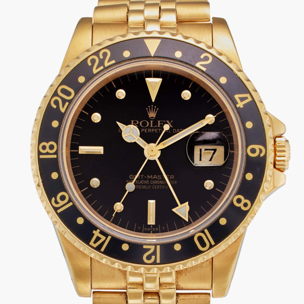 View full screen - View 1 of Lot 399. Reference 16758 GMT-Master | A yellow gold automatic dual time zone wristwatch with date and bracelet, Circa 1984.