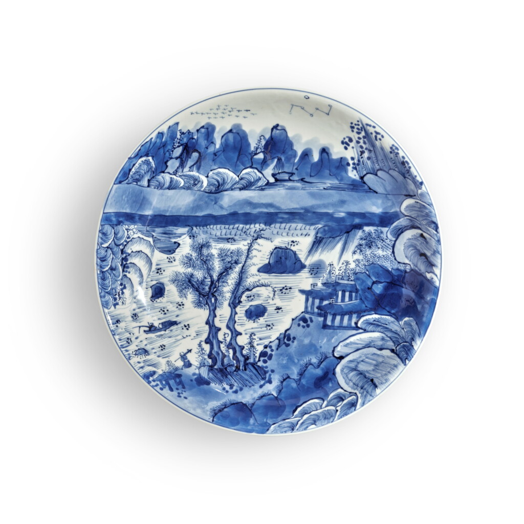 View full screen - View 1 of Lot 325. A large and very rare blue and white 'landscape' dish, Mark and period of Kangxi | 清康熙 青花山水人物圖盤 《大清康熙年製》款.
