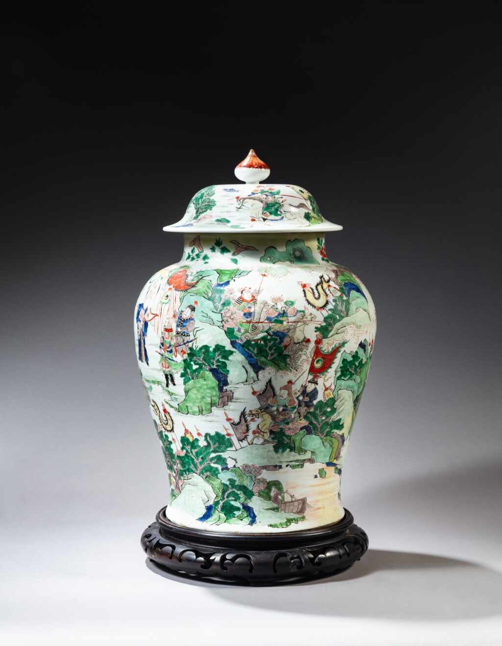 View full screen - View 1 of Lot 181. A famille-verte ‘warriors’ jar and cover, Qing dynasty, Kangxi period | 清康熙 五彩勇戰圖蓋罐.