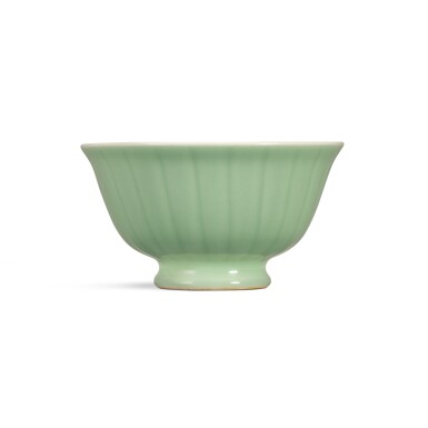 View full screen - View 1 of Lot 139. A celadon-glazed 'ribbed' bowl, Seal mark and period of Qianlong | 清乾隆 青釉瓜棱式高足盌 《大清乾隆年製》款.