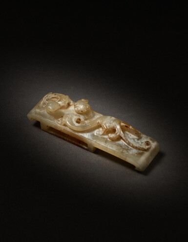 View full screen - View 1 of Lot 217. An archaic jade 'chilong' scabbard slide, Han dynasty | 漢 玉螭龍紋璏.