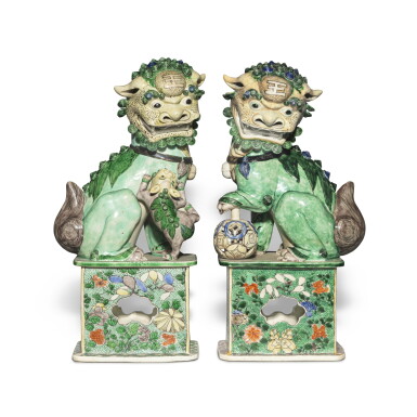 View full screen - View 1 of Lot 600. A large pair of famille-verte biscuit Buddhist lions, Qing dynasty, Kangxi period | 清康熙 素三彩佛獅一對.