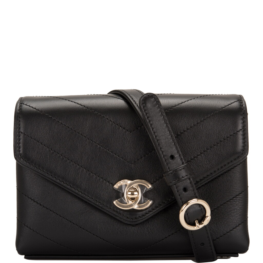 View full screen - View 1 of Lot 95. CHANEL | COCO CHEVRON DOUBLE WRAP WAIST BAG OF BLACK CALFSKIN WITH LIGHT TONE GOLD HARDWARE.