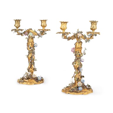View full screen - View 1 of Lot 46. A pair of Louis XV porcelain and tole mounted gilt-bronze twin-branch candelabra, Louis XV, 18th century | Paire de candélabres à deux branches en porcelaine et tole montée en bronze doré, d'époque Louis XV, XVIIIème siècle.