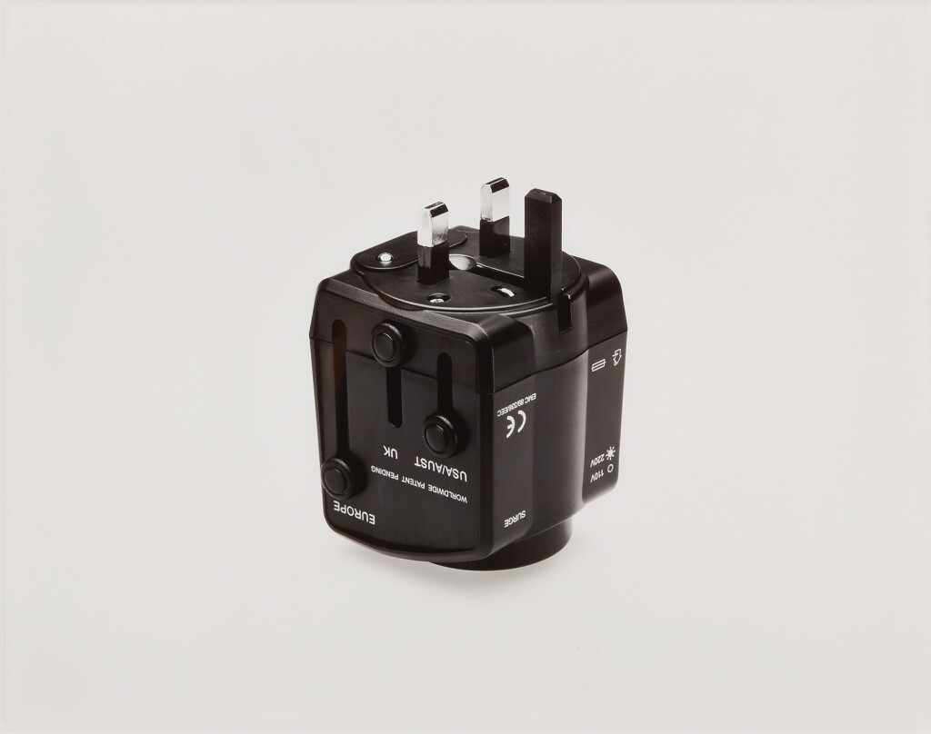 View full screen - View 1 of Lot 489. Universal Travel Adaptor, Scorpio Distributors Ltd., Unit DZ, West Sussex, Great Britain, Product number TXR770000, Power Rating: 6A Max 125/250Vac, With Built-In Surge Protector, With Safety Shutters, Surge Indicator Light 110Vac or 220Vac Light Indicator, Built-In 13A Fuse, Testing based on International Standard IEC 884-2-5 Witnessed by TUV, CE EMC Approval, Photography by the Douglas M. Parker Studio, Los Angeles, California, December 15, 2005..