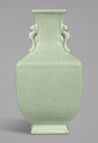 View full screen - View 1 of Lot 25. A RARE CELADON-GLAZED INCISED 'LOTUS' ARCHAISTIC SQUARE VASE, QIANLONG INCISED SEAL MARK AND PERIOD | 清乾隆 粉青釉刻纏枝蓮紋夔龍耳四方尊 《大清乾隆年製》款.
