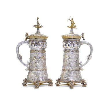 View full screen - View 1 of Lot 135. A MAGNIFICENT PAIR OF GERMAN PARCEL-GILT SILVER TANKARDS, RETAILED BY GORHAM CO., PROVIDENCE RI, CIRCA 1881.