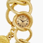 Reference 3649 D80 Dalí d'Or | A limited edition yellow gold bracelet watch with coin pendant, Circa 1972