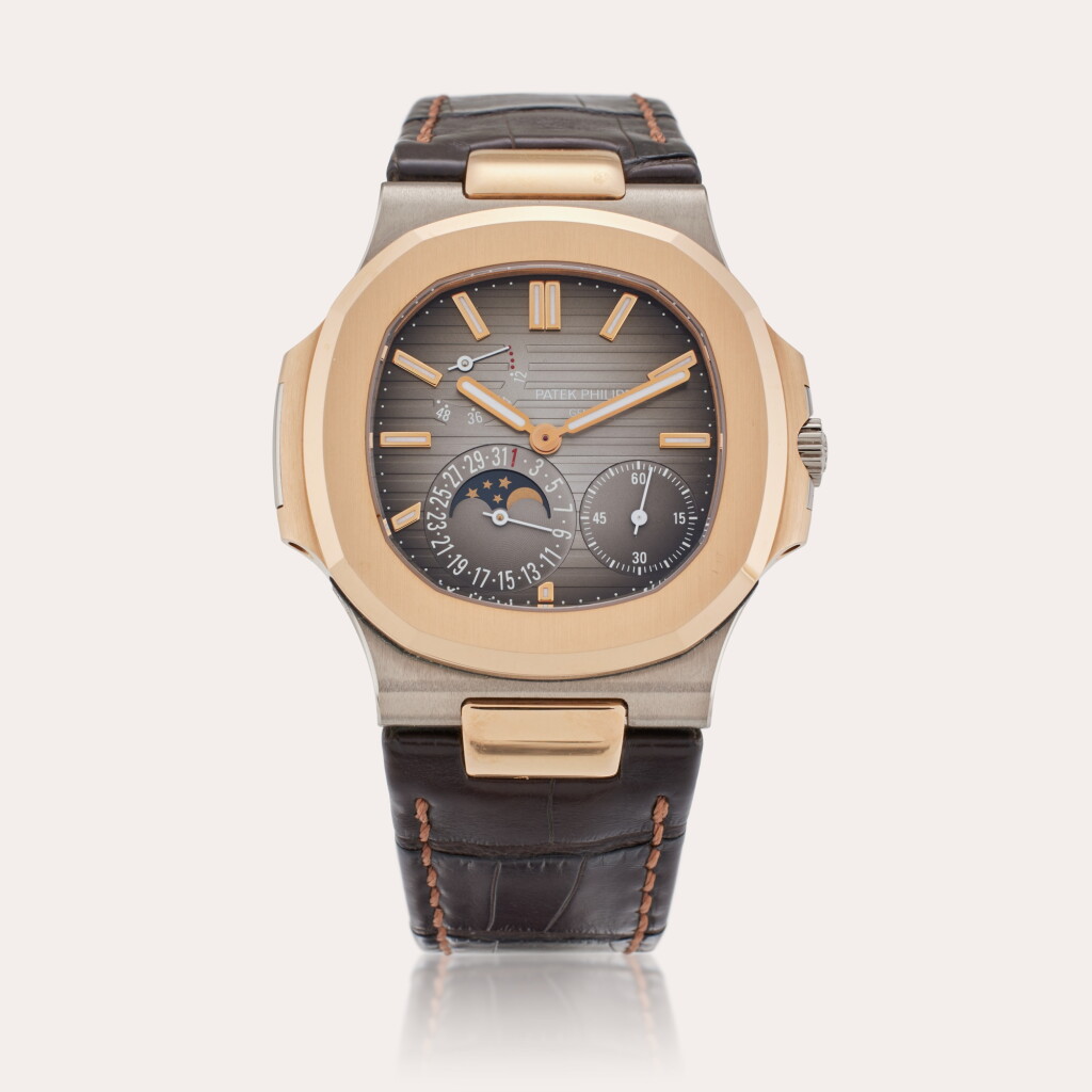 View full screen - View 1 of Lot 33. Reference 5712GR-001 Nautilus | A pink and white gold automatic wristwatch with date, moon phases, and power reserve indication, Made in 2014.