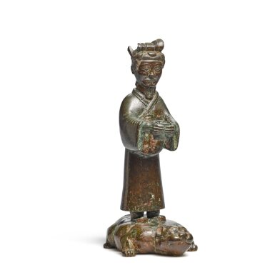 View full screen - View 1 of Lot 15. A bronze figure standing on a crouching beast, Eastern Zhou dynasty, Warring States period | 東周戰國時期 青銅馭獸立人燈座.