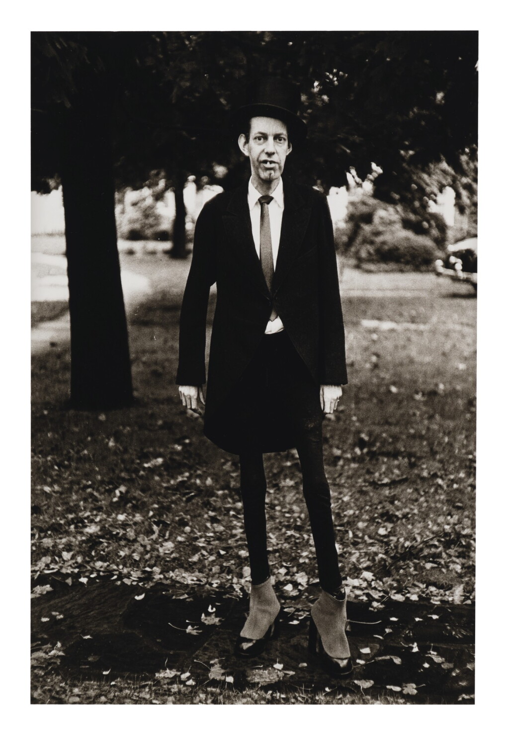 View full screen - View 1 of Lot 102. DIANE ARBUS | A VERY THIN MAN IN CENTRAL PARK, N. Y. C..