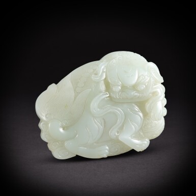 View full screen - View 1 of Lot 6918. A pale celadon jade 'Buddhist lion' belt hook, Qing dynasty, 18th - 19th century | 清十八至十九世紀 青白玉佛獅戲球帶扣.