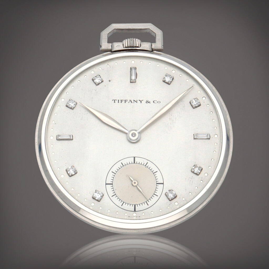 View full screen - View 1 of Lot 336. Retailed by Tiffany & Co.: Reference 600 platinum | A platinum and diamond-set open-faced watch | Made in 1934.