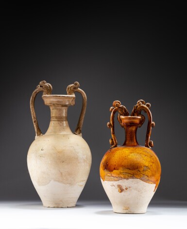View full screen - View 1 of Lot 44. Two pottery 'amphora' vases, Tang dynasty | 唐 白釉及黃釉雙龍耳尊一組兩件.