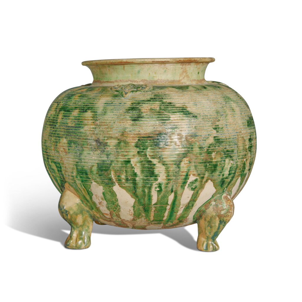 View full screen - View 1 of Lot 665. A rare green-splashed four-footed pottery jar, Tang dynasty | 唐 綠釉四足爐.