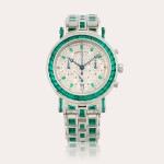 A magnificent and very heavy special order platinum, emerald- and diamond-set chronograph bracelet watch
