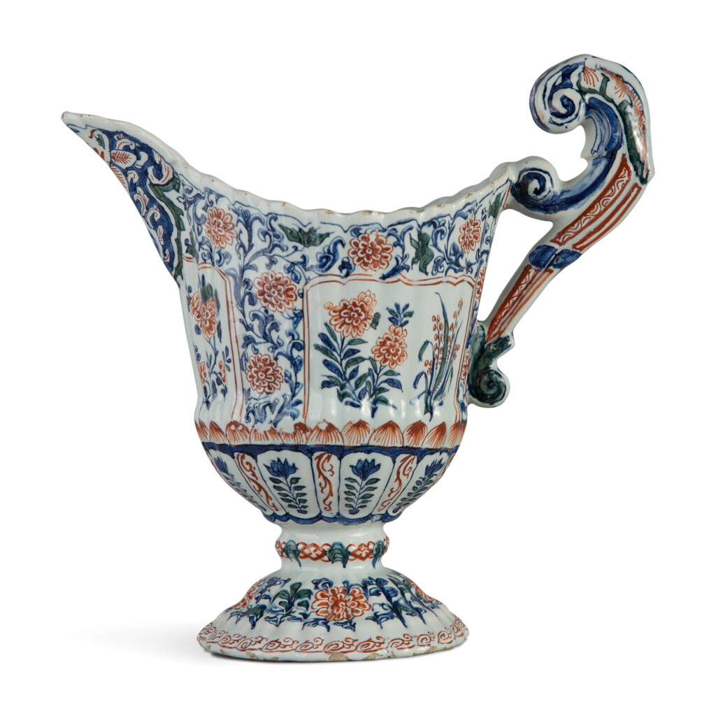 View full screen - View 1 of Lot 559. A DUTCH DELFT POLYCHROME HELMET SHAPED EWER, CIRCA 1710.