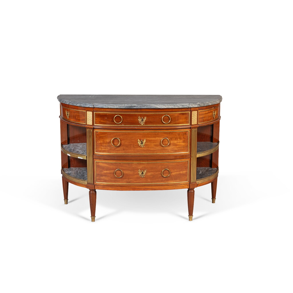 View full screen - View 1 of Lot 424. A Louis XVI gilt-bronze mounted mahogany and mahogany veneered commode à l'anglaise, circa 1780, stamped by Jean-François Leleu.