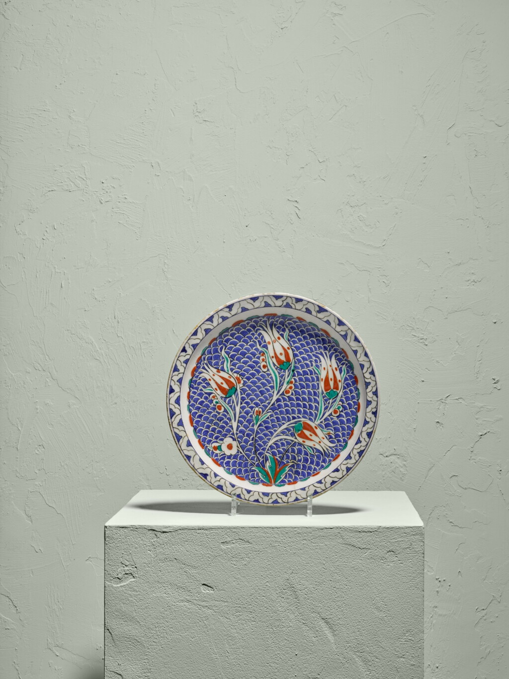 View full screen - View 1 of Lot 131. A rare Iznik polychrome pottery dish with tulips on scale ground, Turkey, circa 1580.